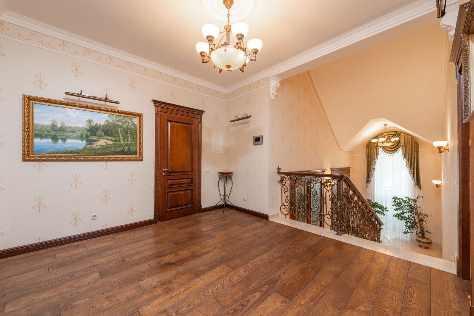 Classic interior with ornate wrought-iron staircase railing